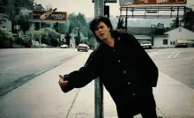 John Taylor of duran duran hitchhiking on side of road