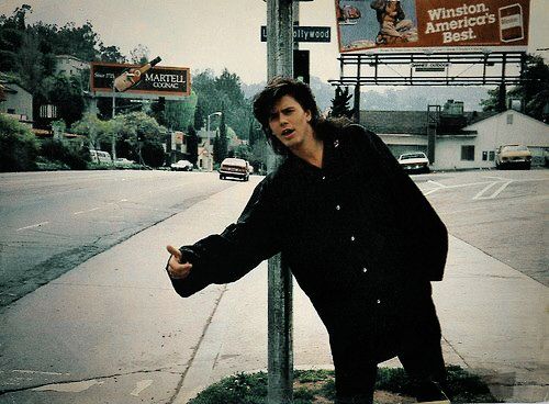 John Taylor of duran duran hitchhiking on side of road