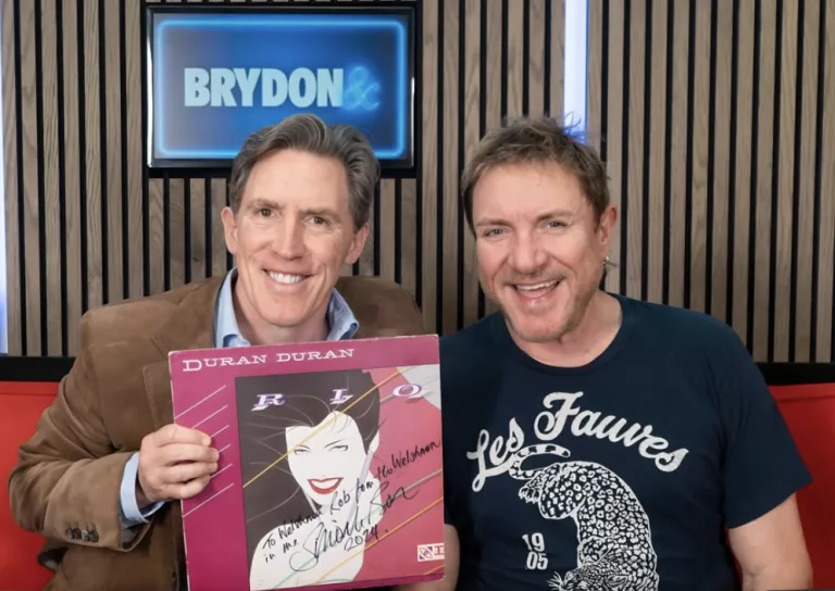 Join Rob Brydon and Simon Le Bon for a hilarious and insightful conversation about Duran Duran, songwriting, Halloween albums, and more! Discover the secrets to their longevity, the stories behind the hits, and Le Bon's viral Ibiza singalong. A must-listen for music fans!