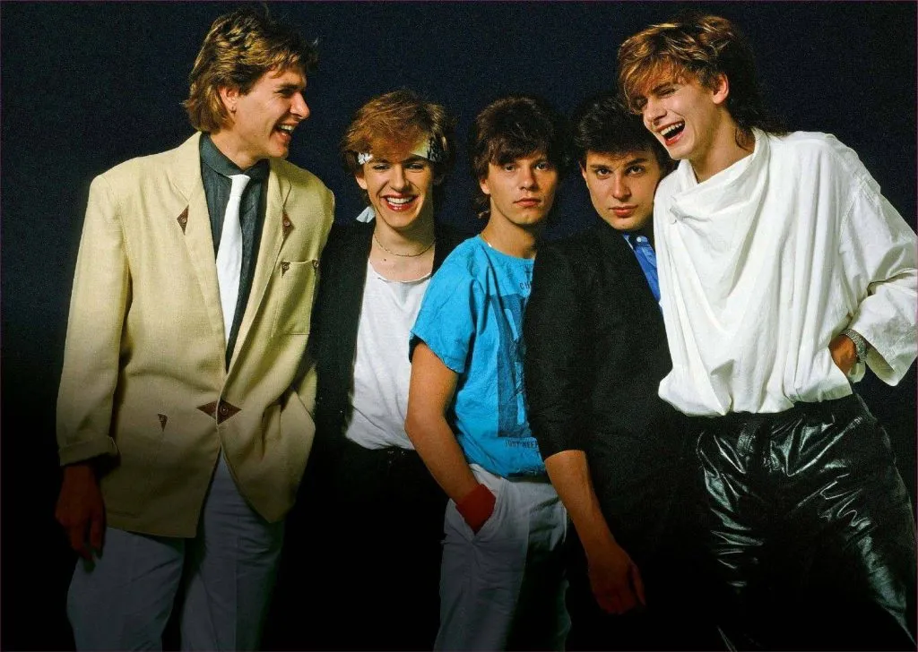 A heartfelt love letter to Duran Duran from lifelong fans, celebrating the band’s music, milestones, and legacy—from 'Rio' summers to 'Ordinary World' reflections. Featuring personal messages to Simon, John, Nick, Roger, Andy, and Dom, plus fan memories, friendships, and the evolution of Duranies through decades